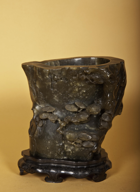 Spinach jade libation cup carved to replicate a rhinoceros horn. Image courtesy of John McInnis Auctioneers.